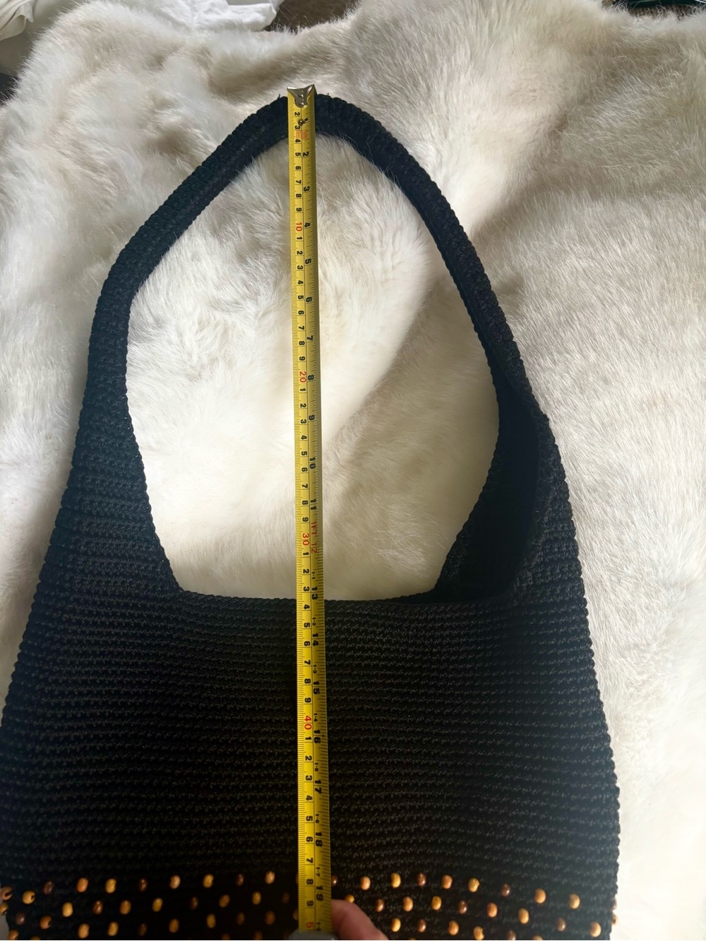 The SAK Black Crochet Shoulder Bag with brown beads.